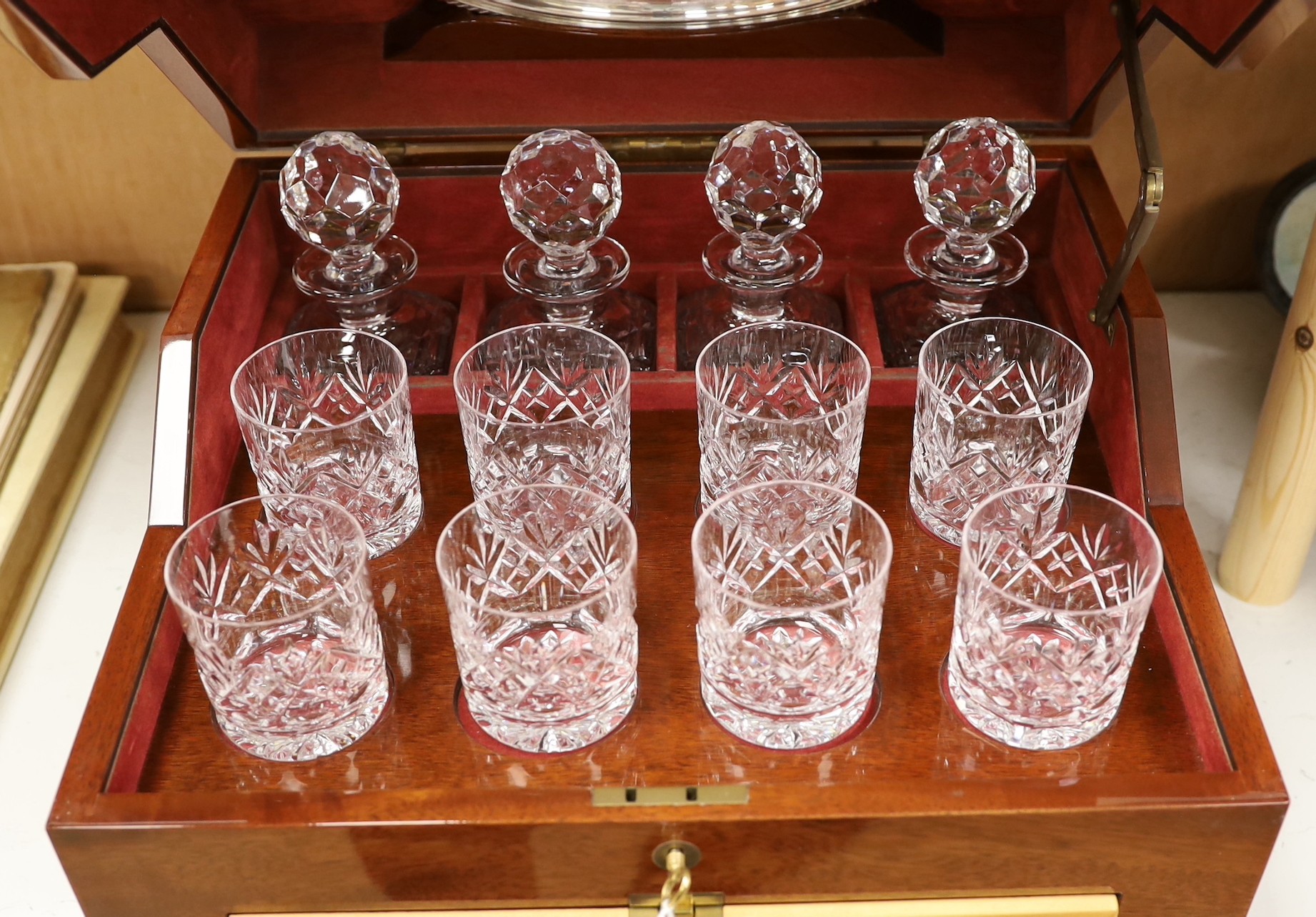 An inlaid travelling decanter box, with lower drawer and a set of Royal Doulton glasses
